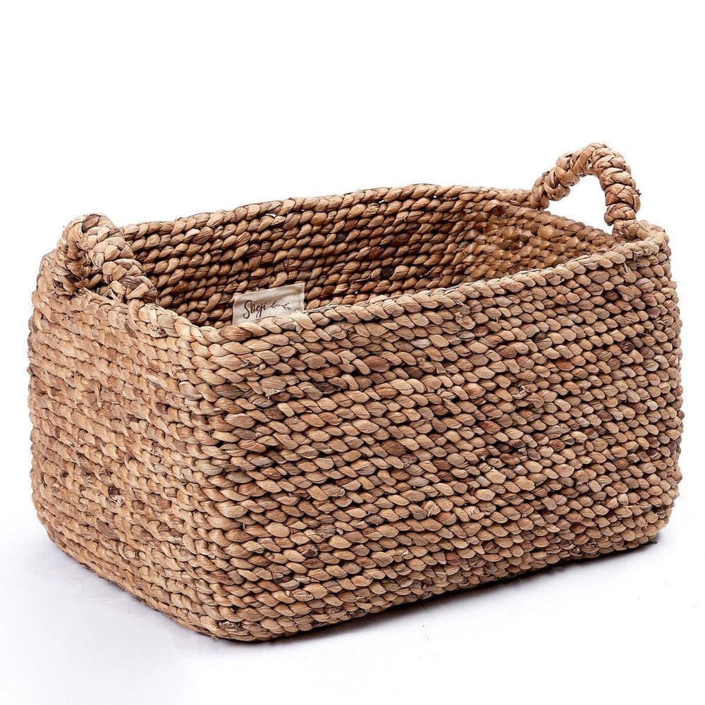 Woven basket with handles on a white background