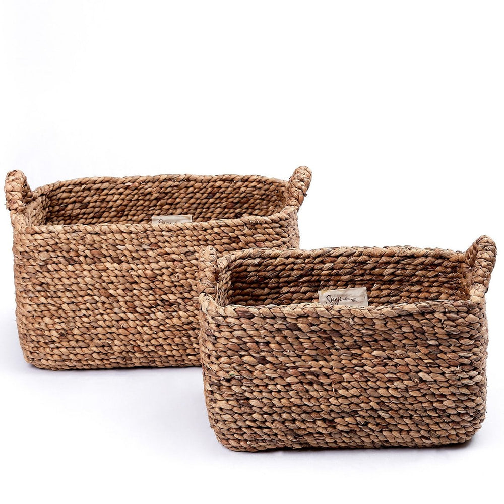 Two woven baskets on a white background