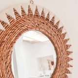Round woven banana fibre wall mirror with white cotton pattern