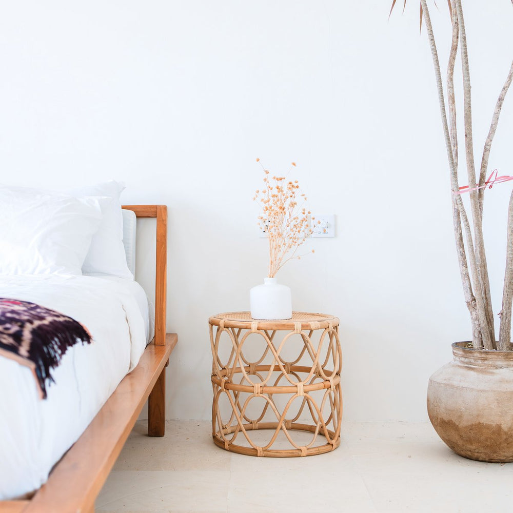 Beige round rattan side table