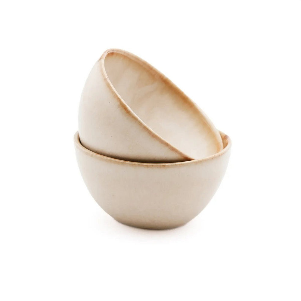 White stoneware cereal bowl with cinnamon-toned drip glaze