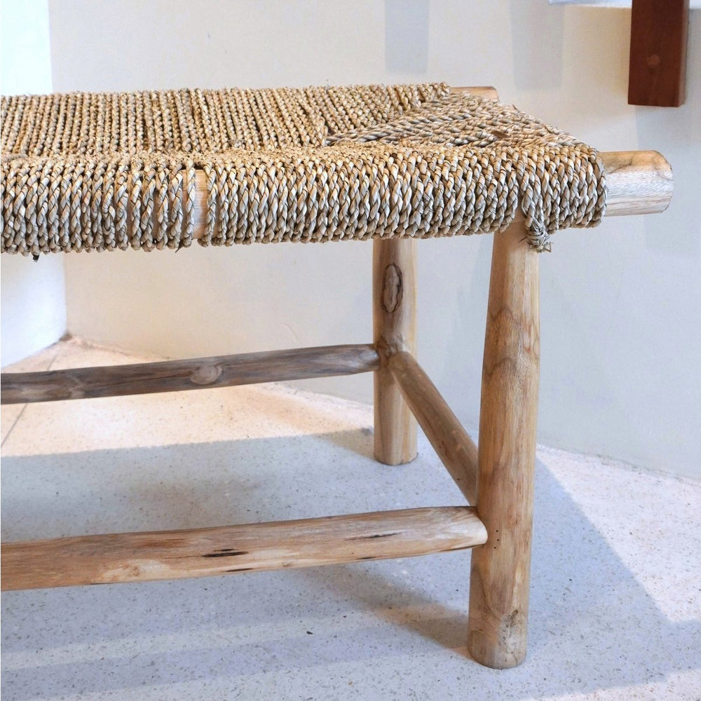 Beige wood bench with woven seagrass seat