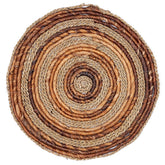 Round woven mat with brown and beige colors on a white background