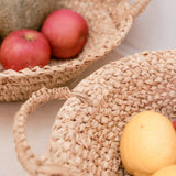 Woven baskets with fruits on a light background