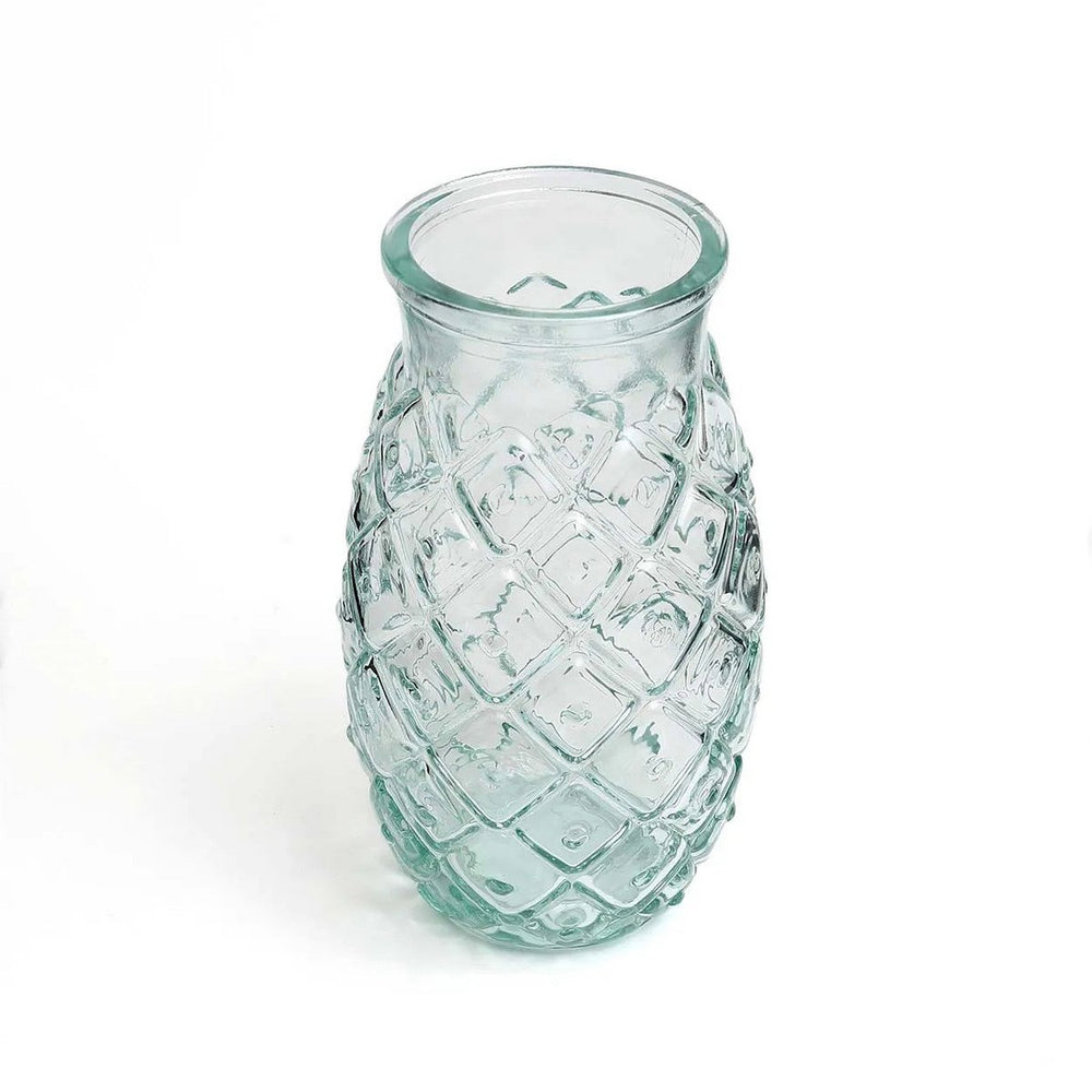 Clear glass vase with textured pattern on a white background