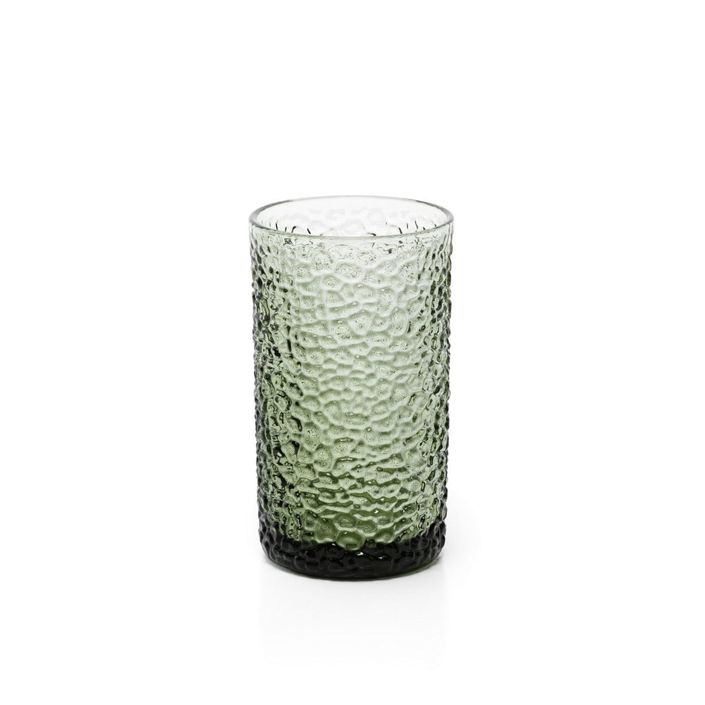 Green textured glass tumbler on a white background