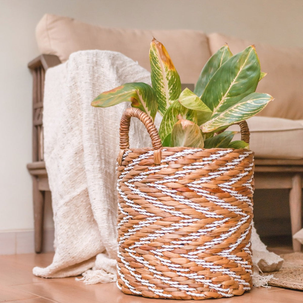 White and beige woven water hyacinth basket with striped pattern