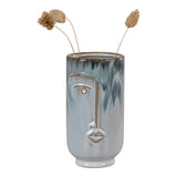 Blue porcelain vase with hand-painted face design