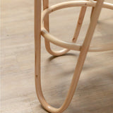 Natural rattan stool with woven seating surface