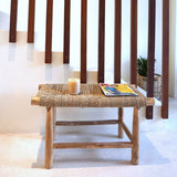 Beige wood bench with woven seagrass seat