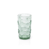 Green textured glass tumbler on a white background