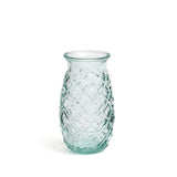 Clear glass vase with textured pattern on a white background