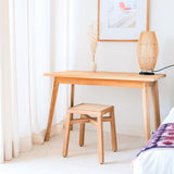 Brown wooden stool with woven rattan seat