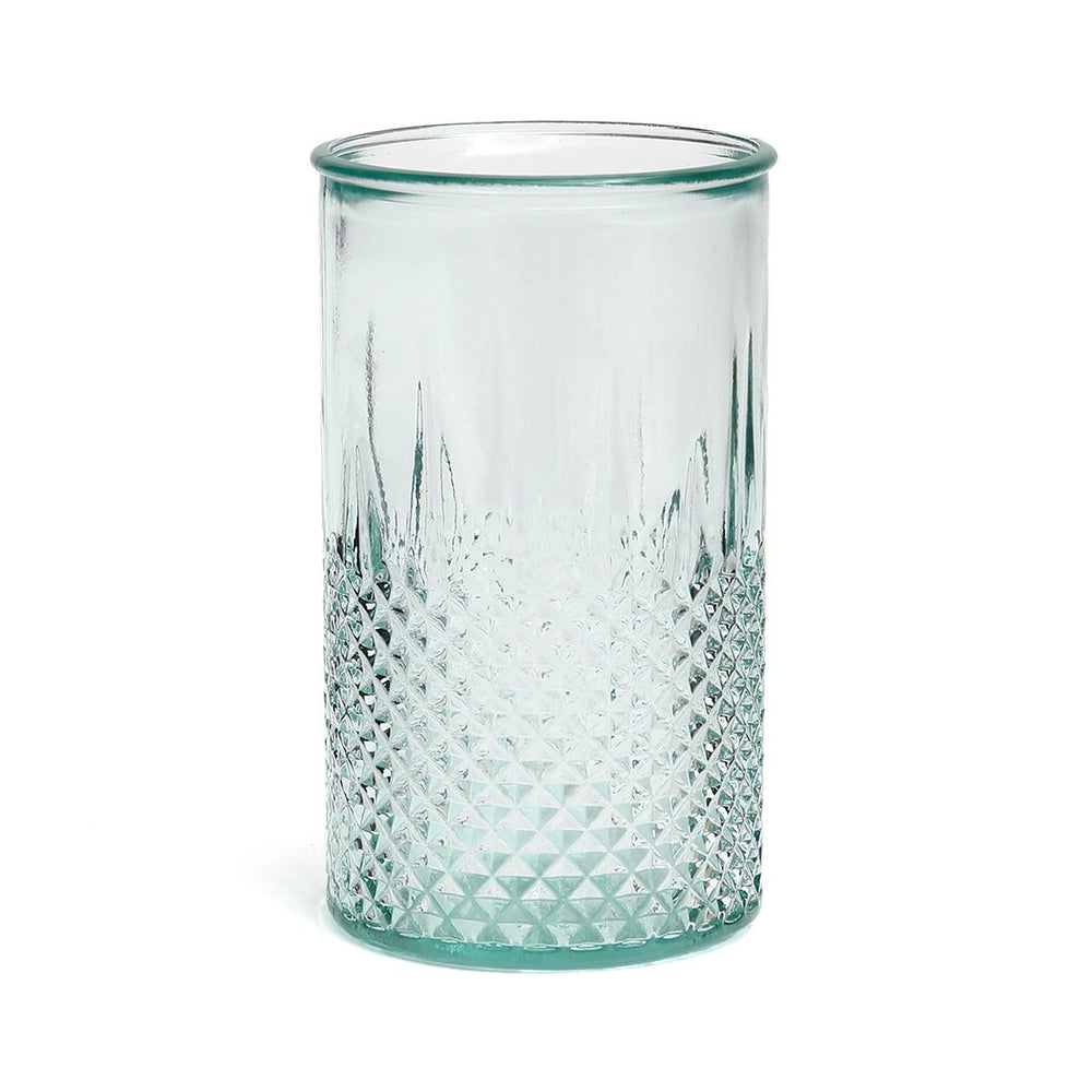 Clear glass tumbler with diamond pattern on a white background