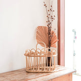 Beige rattan newspaper basket with two compartments
