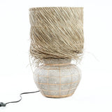 Beige and grey terracotta table lamp with rattan grid and fringed grass shade