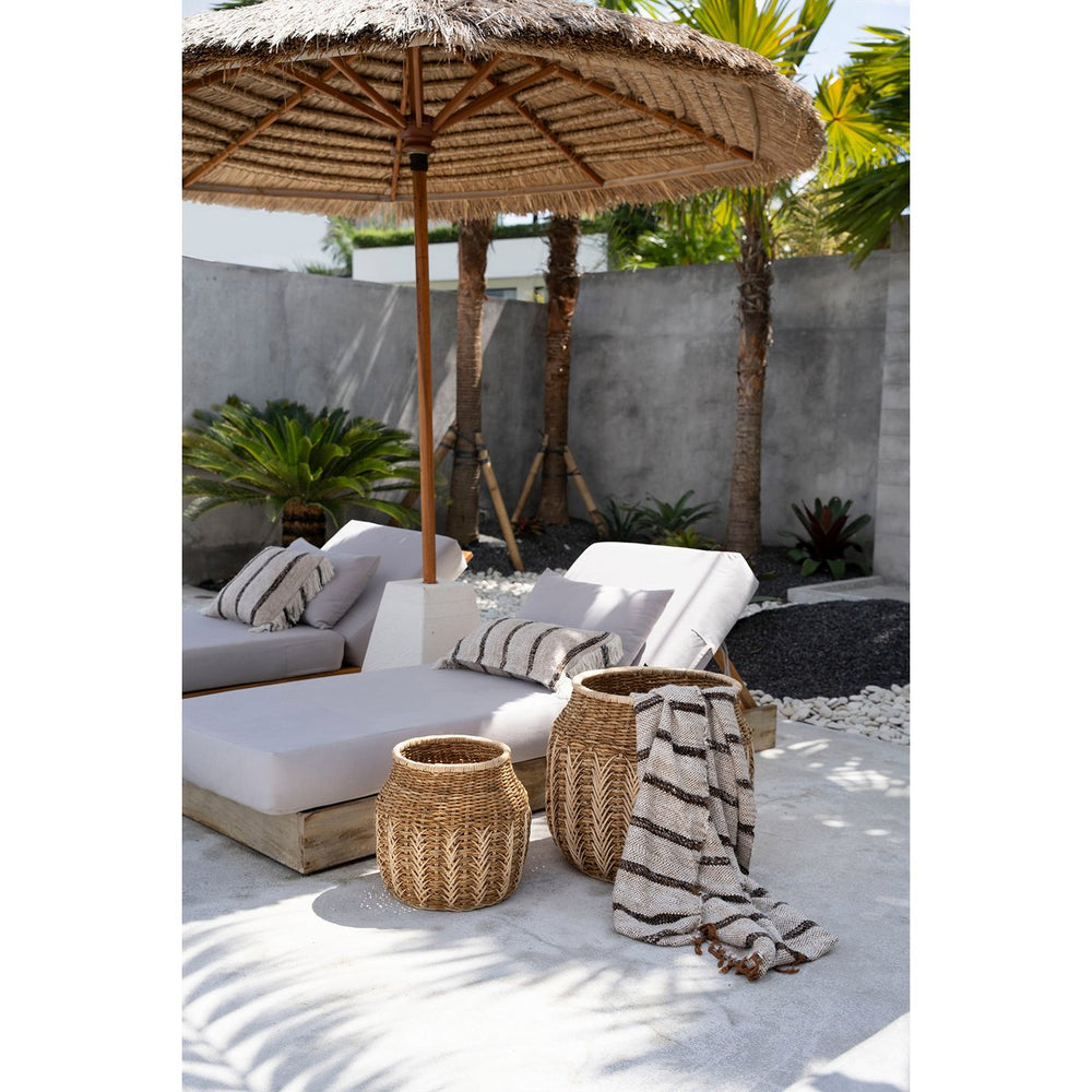 White fringed cotton throw with charcoal stripes and terracotta tassels