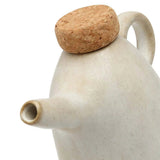 Ceramic teapot with cork lid on a white background