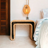 Beige rattan side table with metal frame