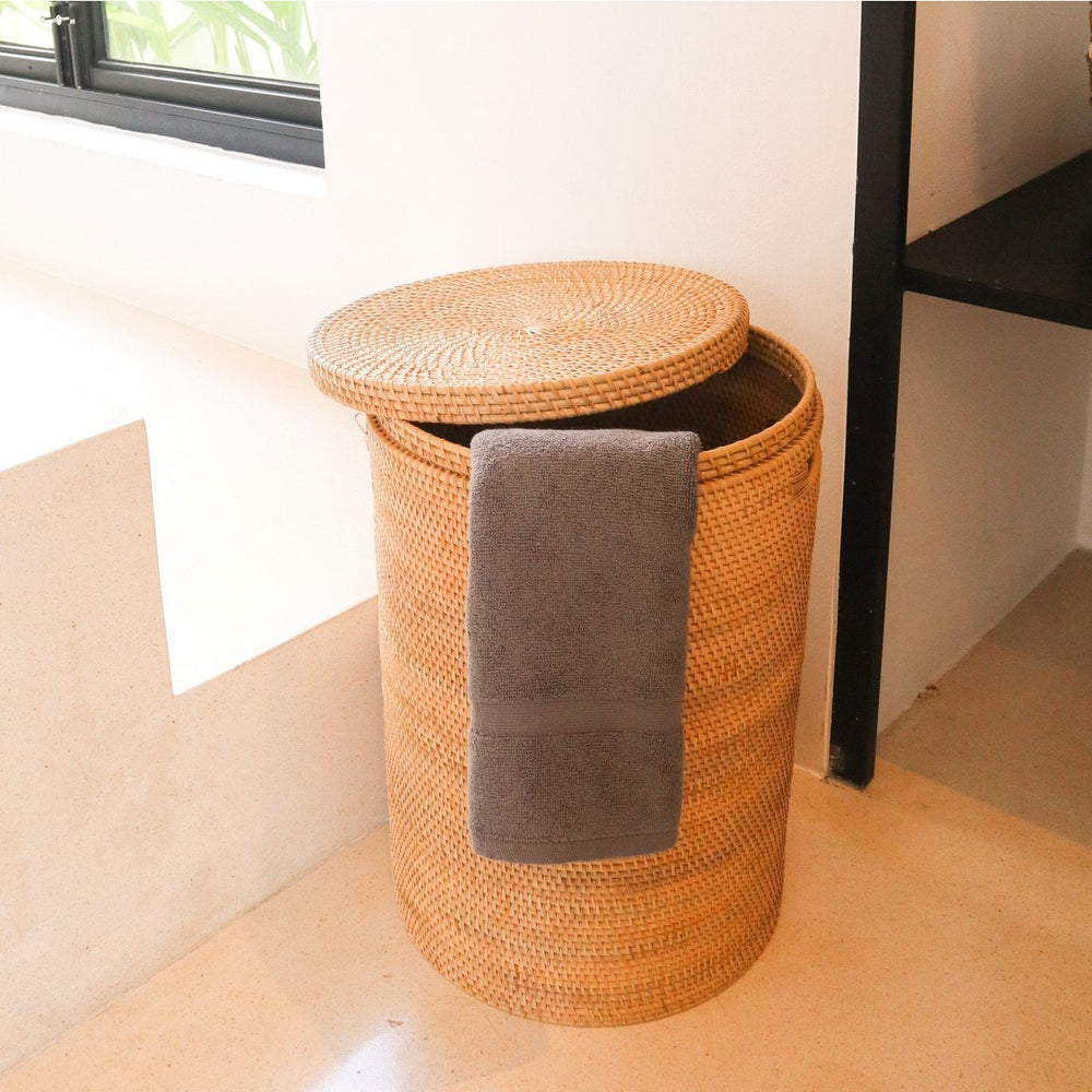 Beige woven rattan laundry basket with lid