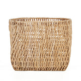 Natural palm leaf basket on a white background