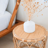 Beige round rattan side table