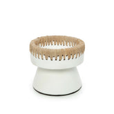 White pedestal with woven top on a white background