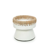 White pedestal with woven top on a white background