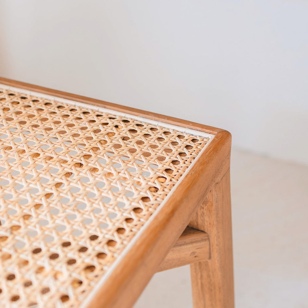 Brown wooden stool with woven rattan seat