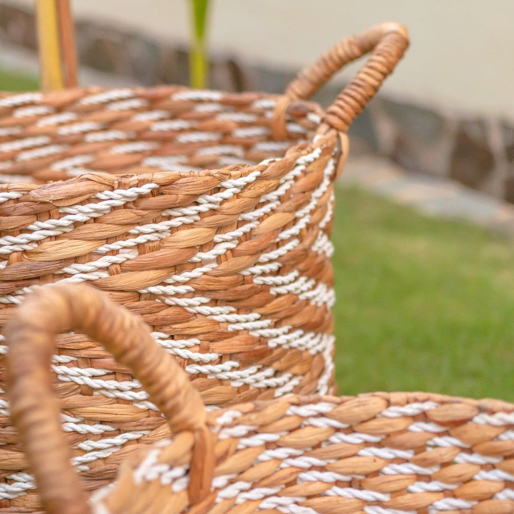 White and beige woven water hyacinth basket with striped pattern