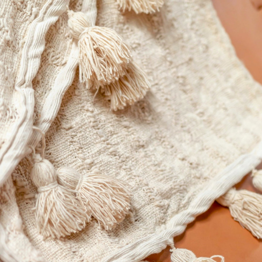 Beige handwoven cotton blanket with striped weave