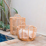 Beige woven rattan laundry basket with handles