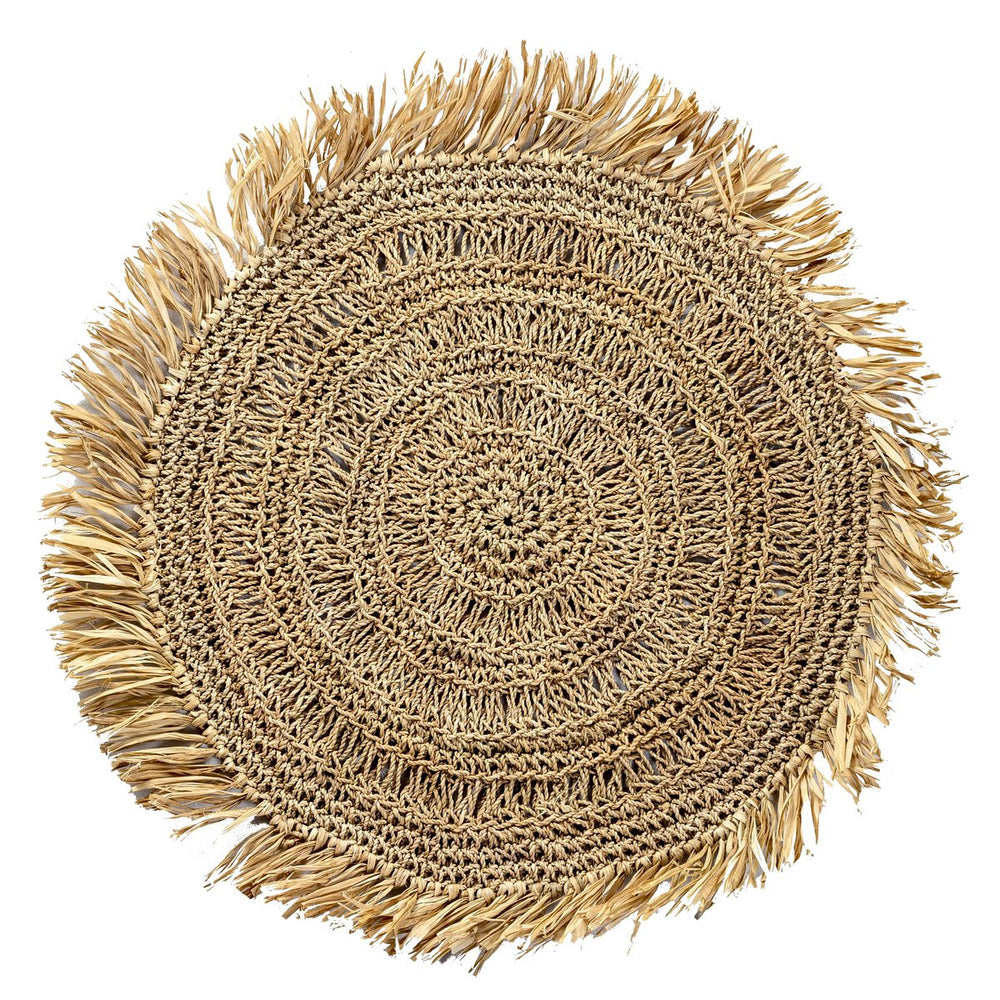Round woven mat with frayed edges on a white background