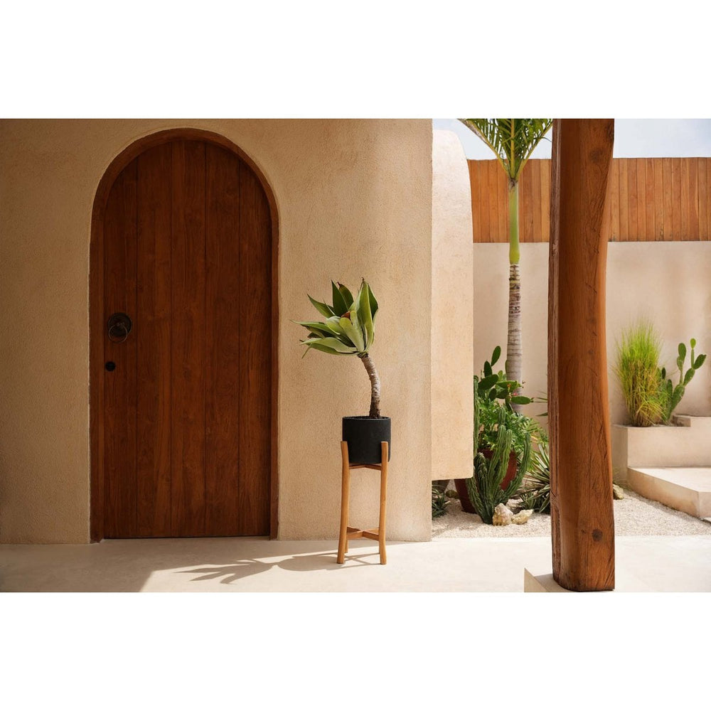 Black terracotta planter on teak branch stand