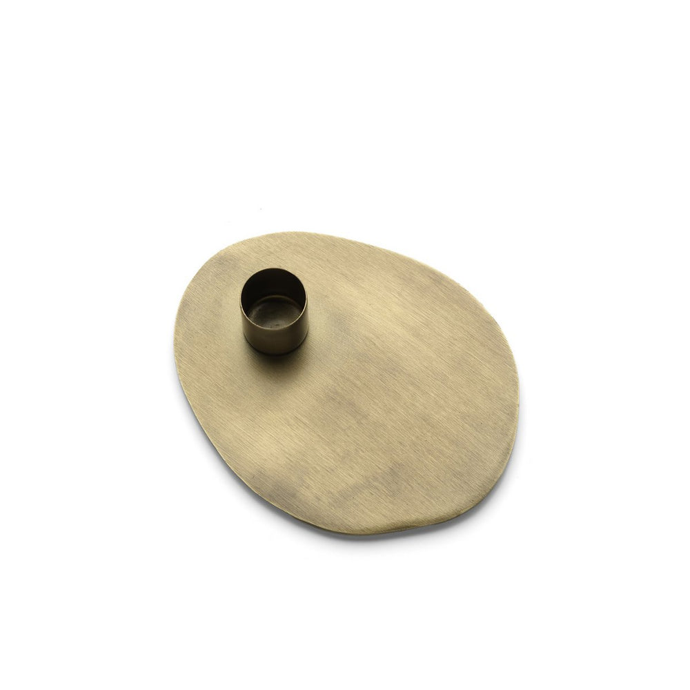 Brass candle holder on a white background