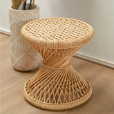 Beige rattan round side table with hourglass-shaped struts