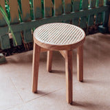 Brown wooden stool with woven rattan seat