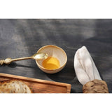 White stoneware sauce bowl with amber rim
