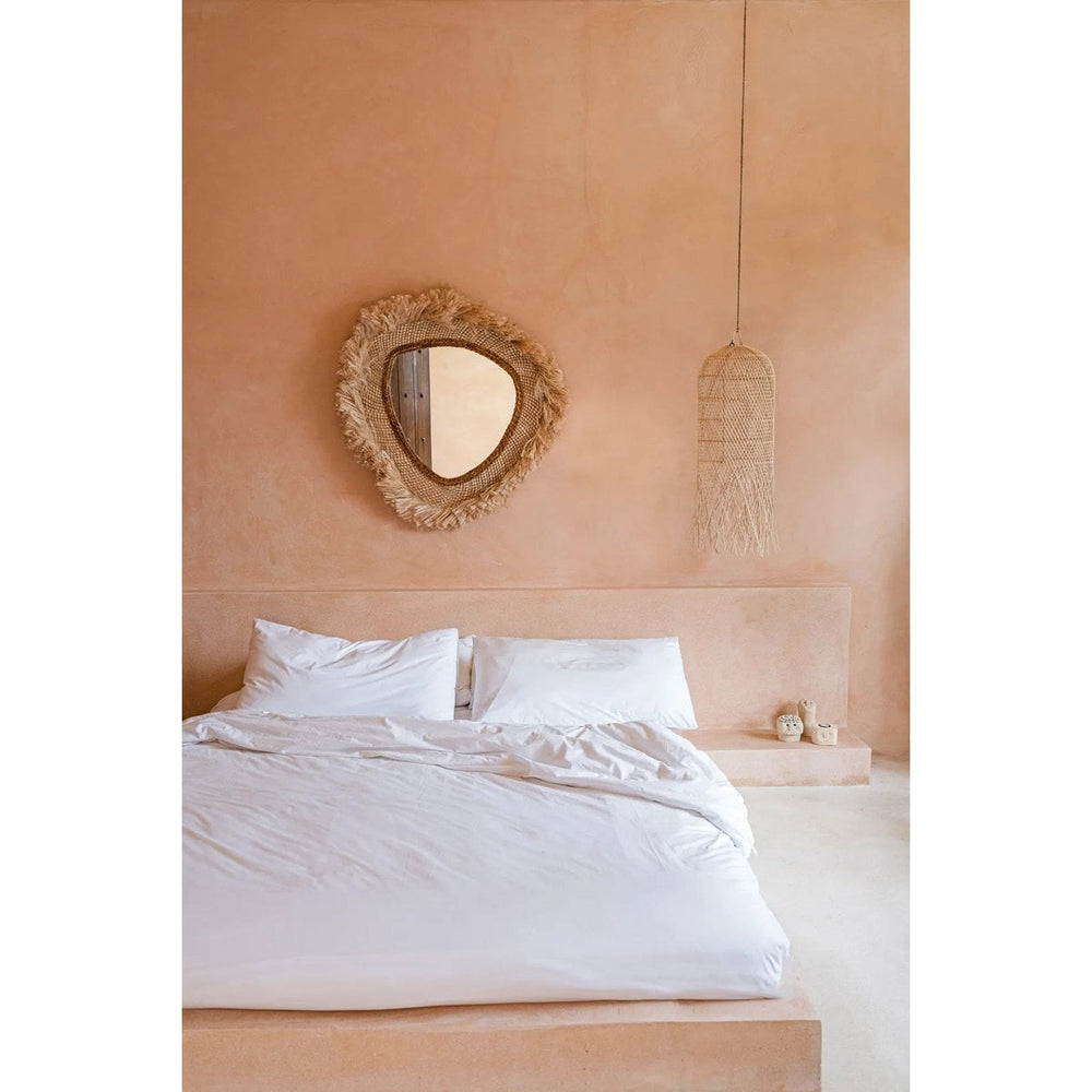 Beige round grass-framed mirror