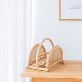 Beige woven rattan newspaper rack with handle