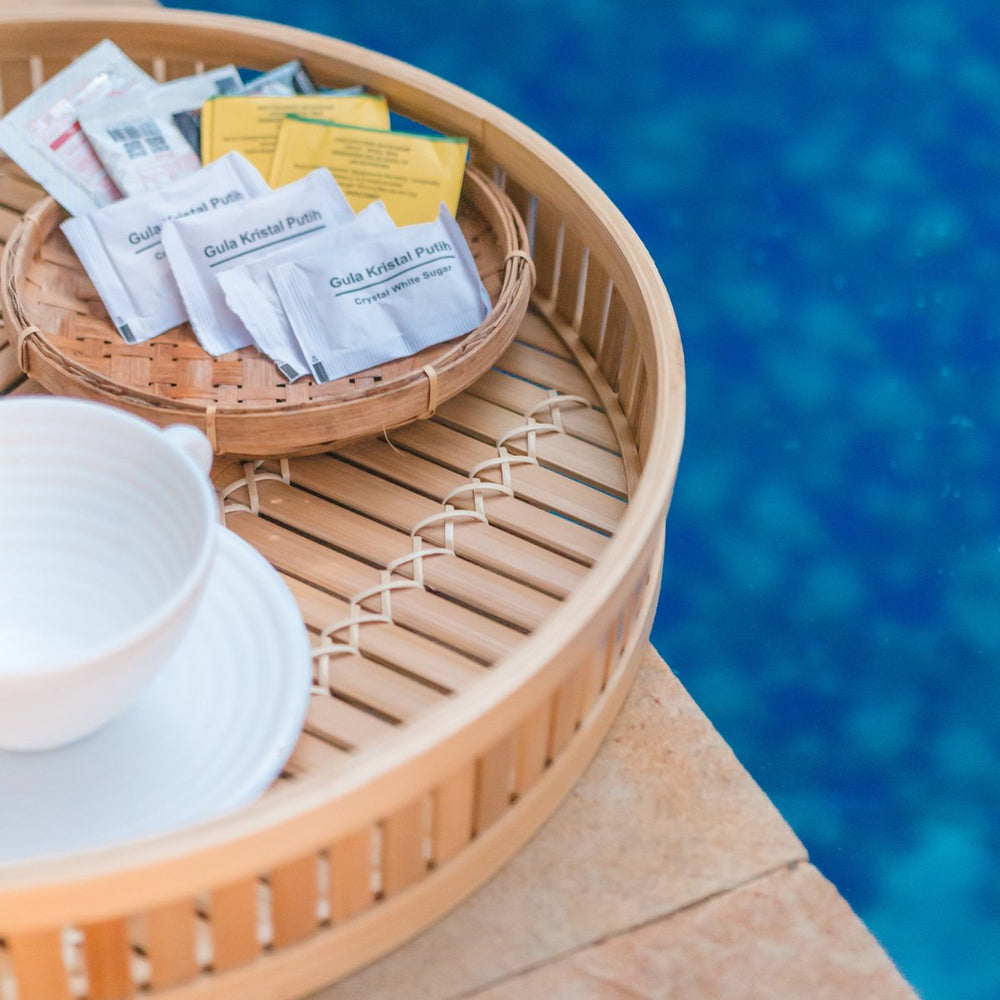 Beige round bamboo serving tray