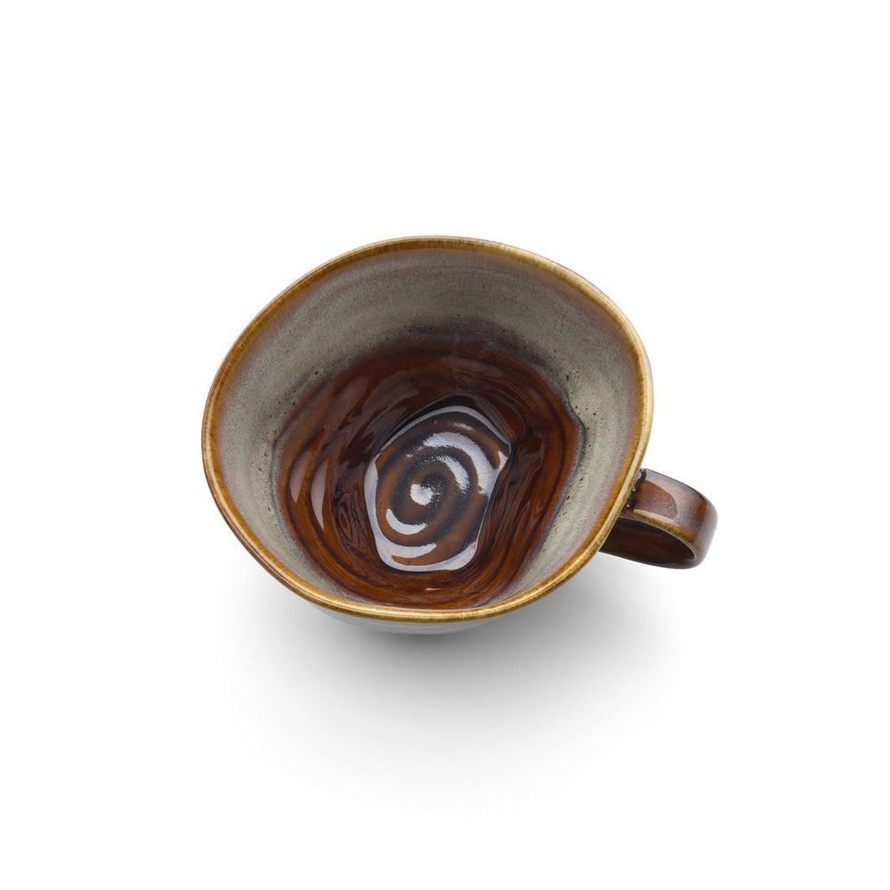 Ceramic mug with brown interior and handle on a white background