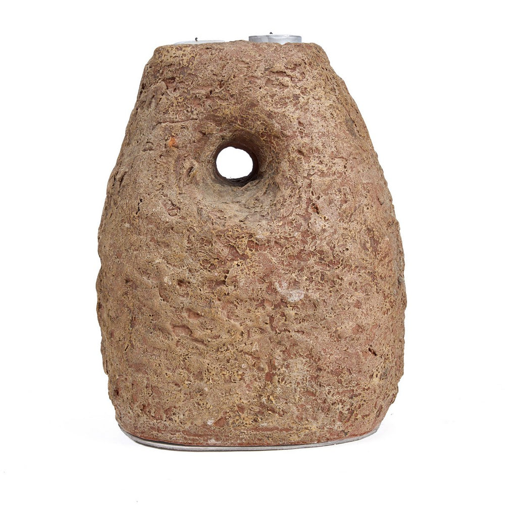 Cylindrical stone-like object with a central hole on a white background