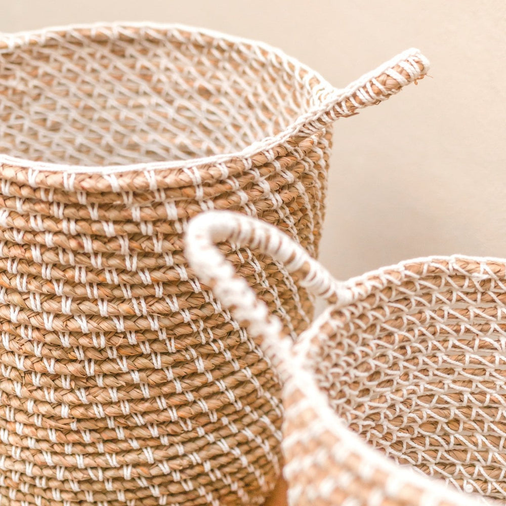Beige woven banana fibre storage basket with white cotton cord pattern
