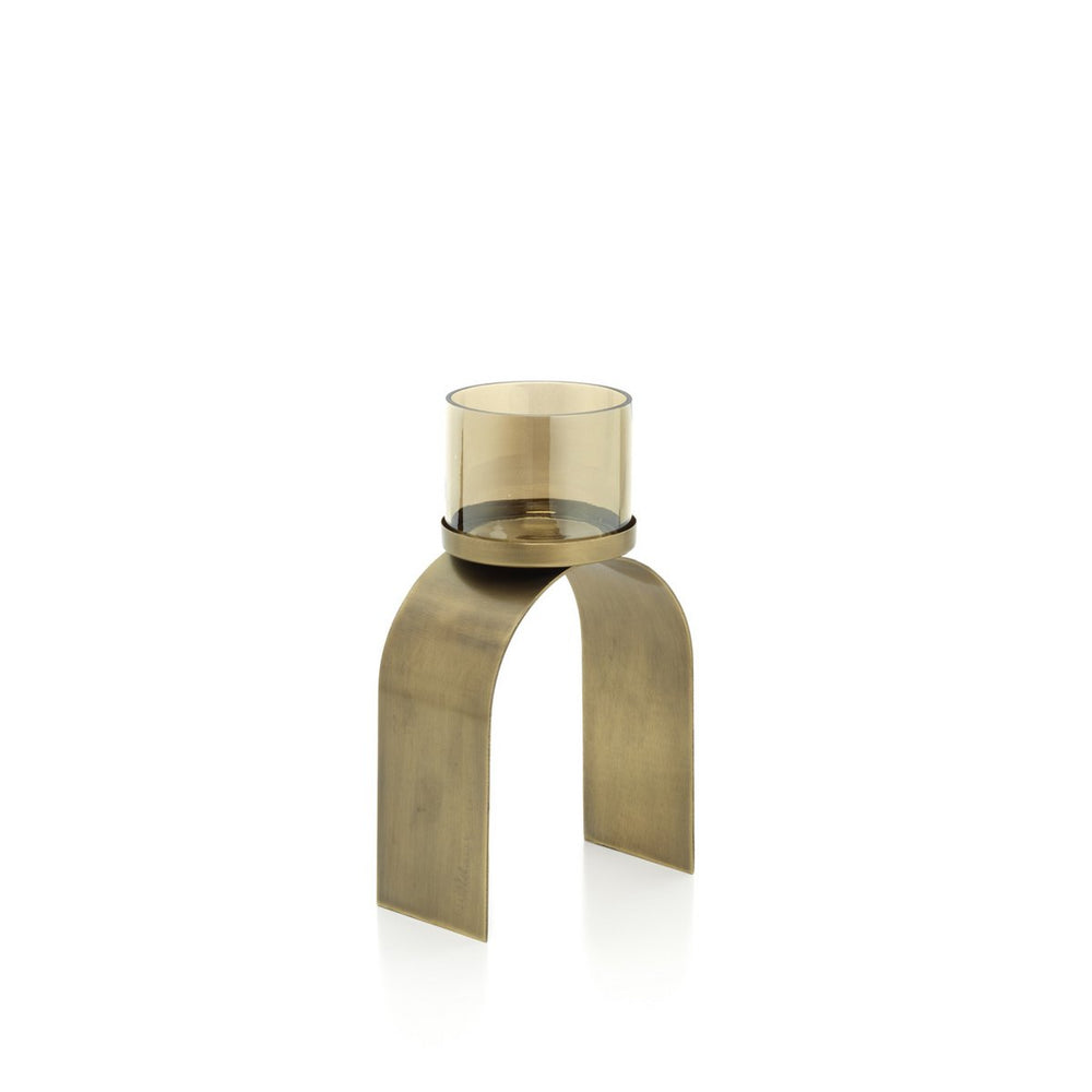 Bronze candle holder with glass candle on a white background