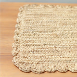 Beige woven placemat on a wooden surface