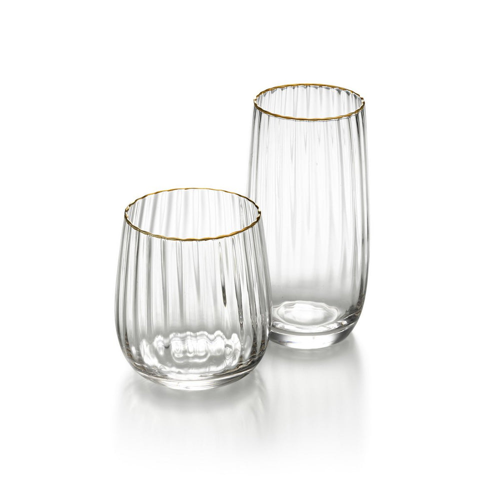 Two clear glass tumblers with gold rims on a white background