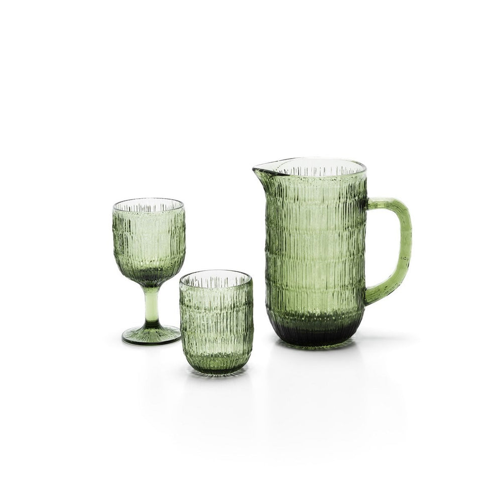 Set of green glassware including a pitcher and two glasses on a white background