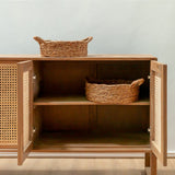 Wooden cabinet with wicker baskets on a light background