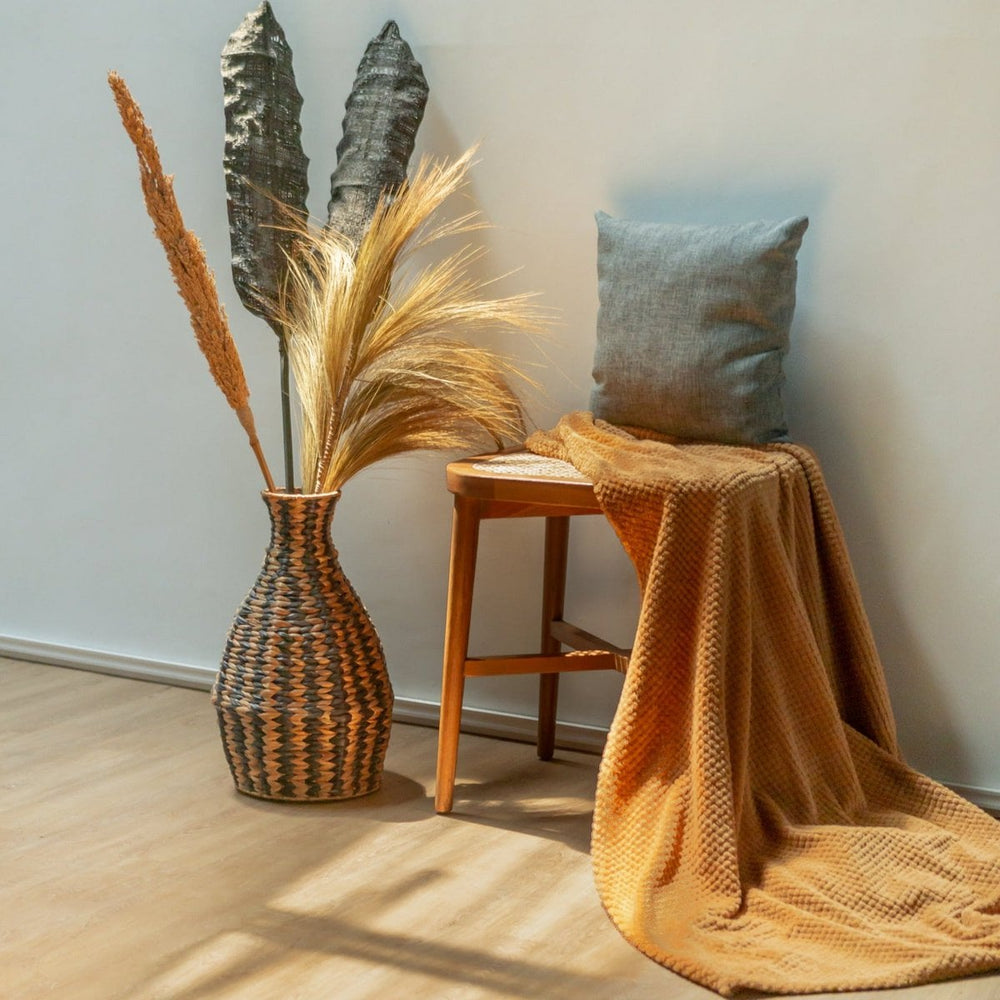 Black and natural woven water hyacinth vase